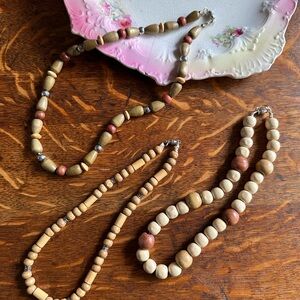 Set of three lightweight chunky wooden bead necklaces twist clasp strung on hemp